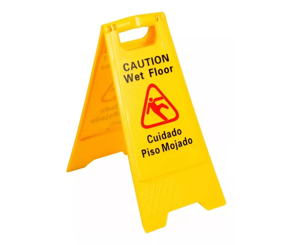 Caballete de "Piso mojado" en español e inglés para prevención de caídas.